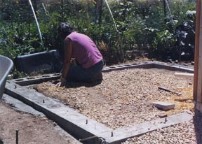 Here we are finishing the foundation for the cistern; which will collect water off the roof via gutters, and deliver the water to the plants by way of soaker hoses and drip irrigation